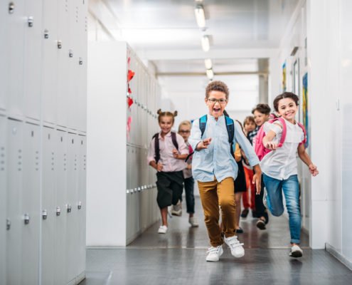 Young school aged kids running through the halls because someone has lice!